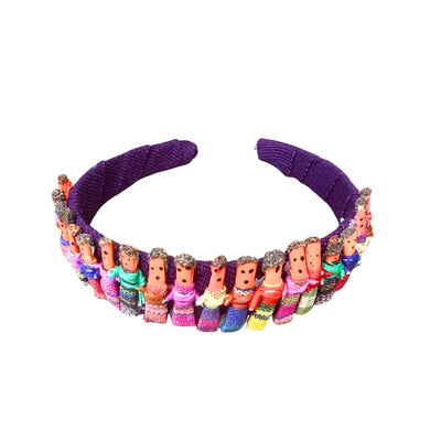 Purple worry doll headband with colorful figurines on a white background