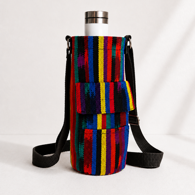 Colorful striped bag with a black strap on a white background
